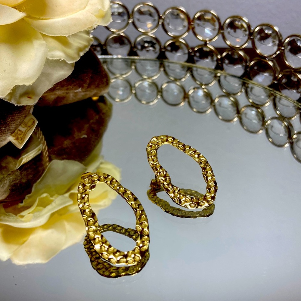 Gold color oval earrings.